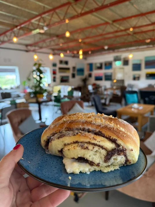 Inside the Common Ground community cafe, with artwork on the walls